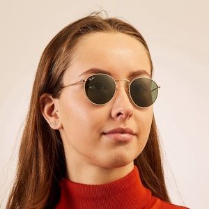 Ray Ban RB3447 Round Metal Gold frame sunglasses.
